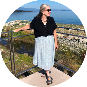 Rose Marion Heaslip standing by the water on a bright day.